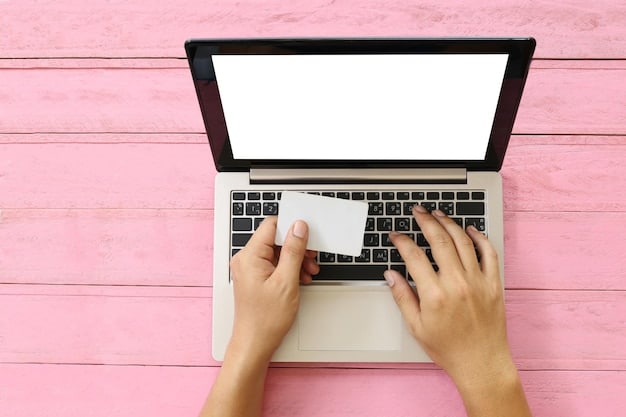 A hand hovering over a laptop keyboard, ready to type in a coupon code. The focus is on the enter key and the surrounding keys typically used for typing codes. The screen displays a shopping cart with a highlighted coupon code field.