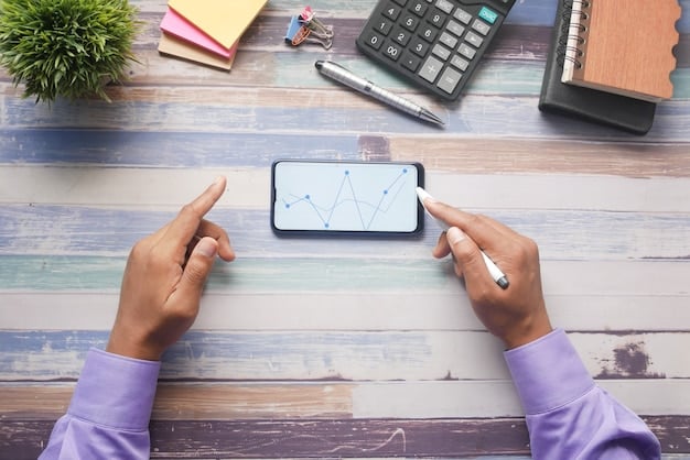A person holding a phone with a budgeting app open on the screen, showcasing expense tracking and spending limits.