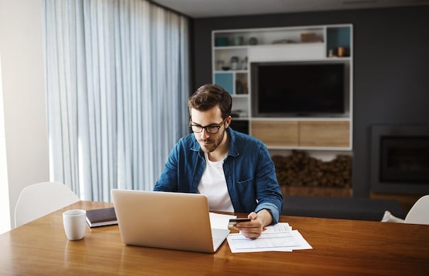 A person using a laptop to shop online with a calculator next to it. A notepad with the words 