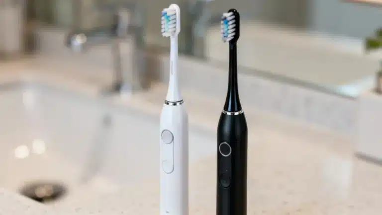 Two modern electric toothbrushes with five brushing modes displayed.